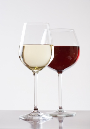 Studio shot of elegant  glasses with red and white wine.の写真素材
