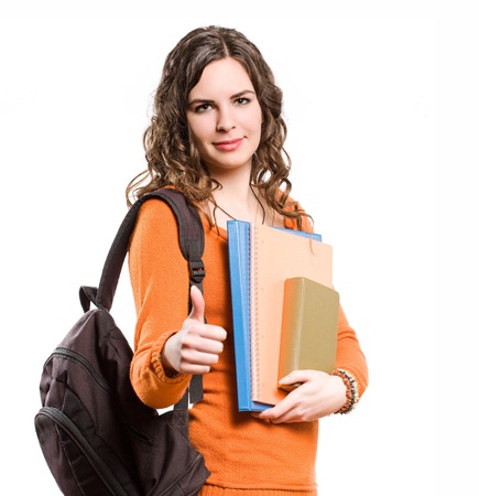 Portrait of smiling friendly young female student isolated on white background.の写真素材