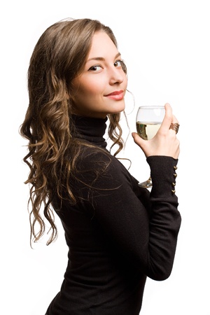 Gorgeous slender young brunette woman holding glass of wine.の写真素材