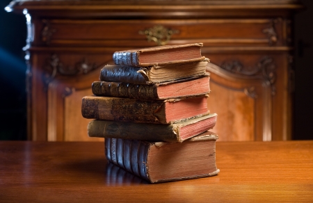 Ancient knowledge, pile of stylish, worn collectors item antique books.の写真素材