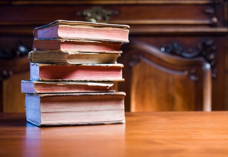 Ancient knowledge, pile of stylish, worn collectors item antique books.の写真素材