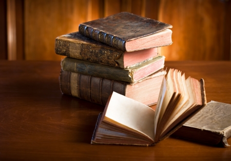 Ancient knowledge, pile of stylish, worn collectors item antique books.の写真素材