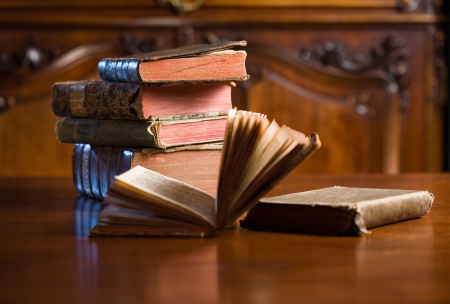 Shot of mysterious looking beautiful worn antique books.の写真素材
