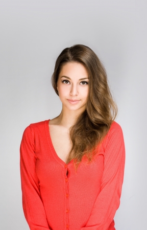 Portrait of a beautiful shy young brunette woman の写真素材