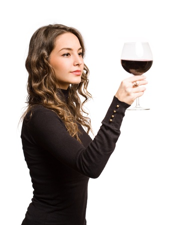 Cool fashionable young brunette woman tasting great wine の写真素材
