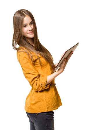 Portrait of a beautiful teen girl using tablet computer.の写真素材