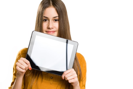 Portrait of beautiful brunette teen using tablet computer.の写真素材