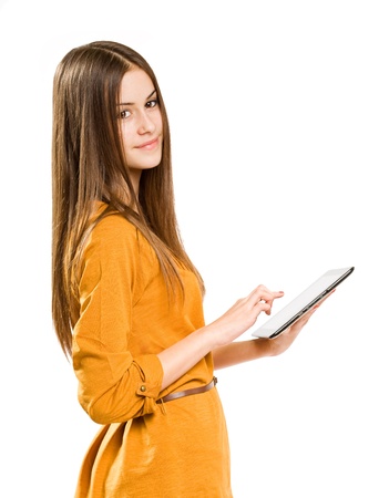 Portrait of beautiful brunette teen using tablet computer.の写真素材