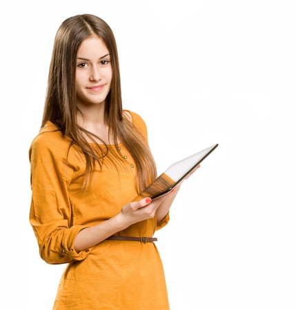 Portrait of a cute cool teen girl using tablet device.の写真素材