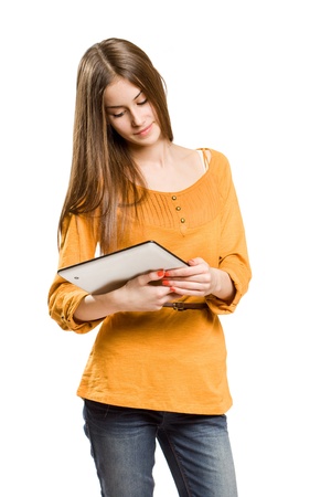 Portrait of a cute cool teen girl using tablet device.の写真素材