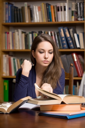 Portrait of busy young brunette student woman.の写真素材