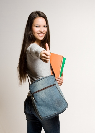 Portrait of a confident young brunette student の写真素材