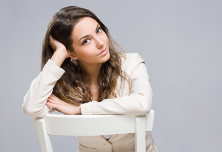 Portrait of pensive looking fashionable young brunette businesswoman の写真素材