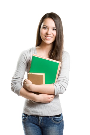 Portrait of cute young brunette student holding exercise books.の写真素材