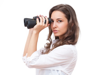 Portrait of fashionable young brunette woman searching employment with binoculars の写真素材