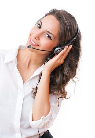 Beautiful young brunette woman in offfice wearing headset.の写真素材