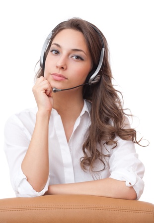 Beautiful young brunette woman in offfice wearing headset.の写真素材