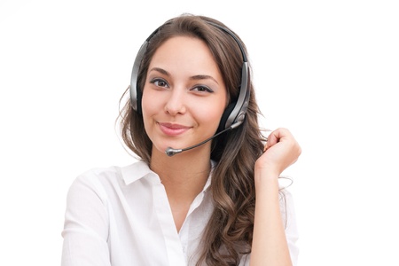 Portrait of smiling friendly office girl wearing headset.の写真素材