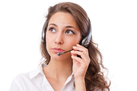 Portrait of a fashionable cute office girl wearing headset.の写真素材