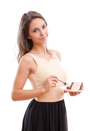 Portrait of fit gorgeous young bruinette woman having tasty cake.の写真素材
