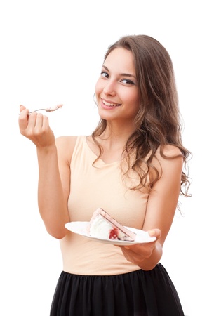 Beautiful young brunette woman being tempted by pastry.の写真素材