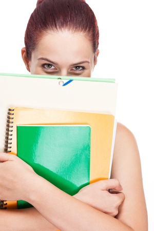 Portrait of attractive young student with colorful exercise books and folders.の写真素材
