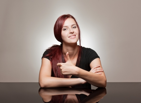Portrait of a redhead beauty with strong facial expression.の写真素材