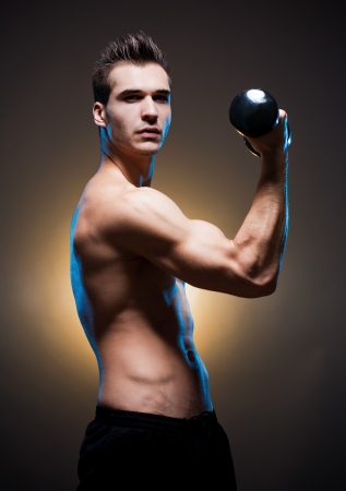 Portrait of a confident looking very lean fit young male athlete.の写真素材