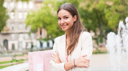Portrait of a beautiful fashionable young shopper woman.の写真素材