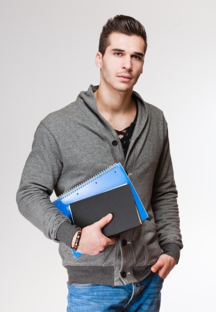 Portrait of a relaxed handsome young male student.の写真素材