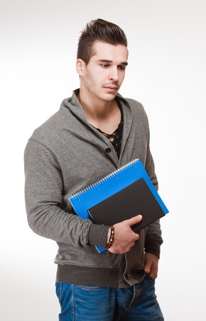 Portrait of a relaxed fashionable handsome young student.の写真素材