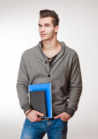 Portrait of a relaxed fashionable handsome young student.の写真素材