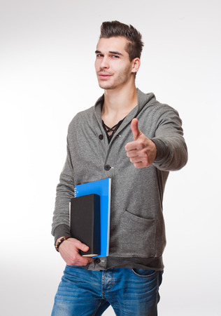 Portrait of a relaxed handsome young male student.の写真素材