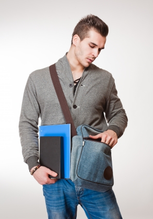 Portrait of a relaxed fashionable handsome young student.の写真素材