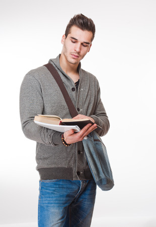 Portrait of a relaxed handsome young male student.の写真素材