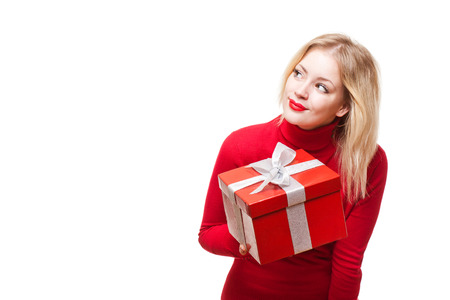 Portrait of a cute young blond with bright red gift box.の写真素材