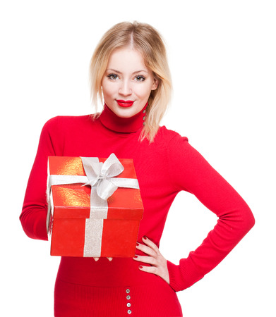 Portrait of a cute young blond with bright red gift box.の写真素材
