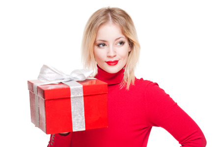 Portrait of a cute young blond with bright red gift box.の写真素材