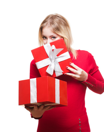 Portrait of a cute young blond with bright red gift box.の写真素材