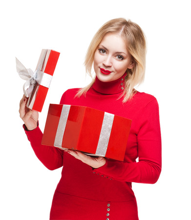 Portrait of a cute young blond with bright red gift box.の写真素材