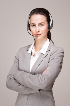 Portrait of a beautiful young businesswoman wearing headset.の写真素材