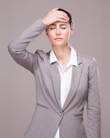Portrait of a beautiful young businesswoman with expressive posture.の写真素材