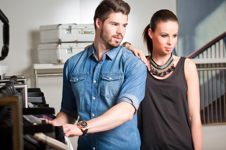 Very attractive, young and fashionable couple shopping clothes.の写真素材