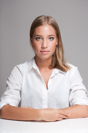 Portrait of a gorgeous expressive young blond beauty.の写真素材