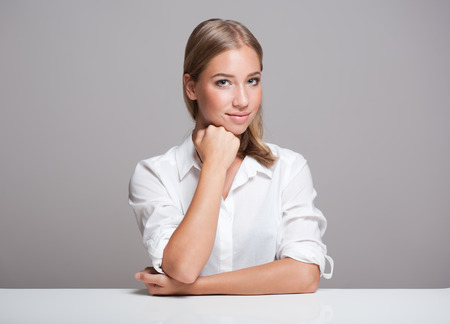 Portrait of a gorgeous expressive young blond beauty.の写真素材