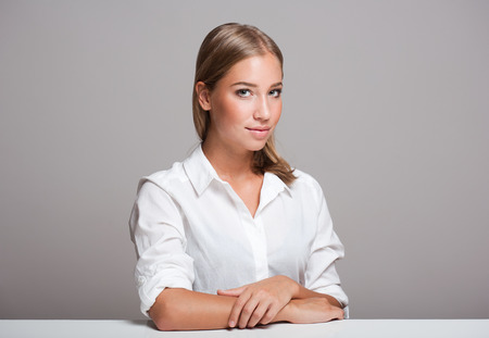 Portrait of a gorgeous expressive young blond beauty.の写真素材