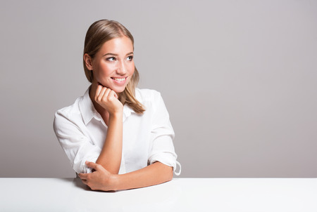 Portrait of a gorgeous expressive young blond beauty.の写真素材