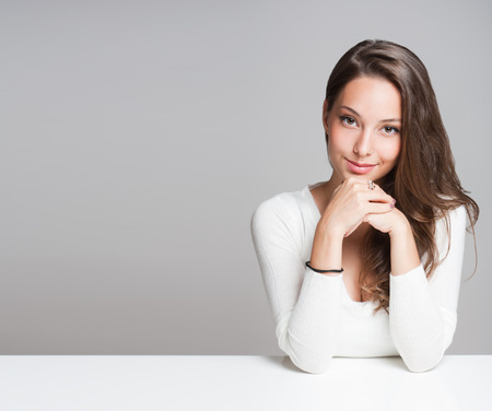 Portrait of a beautiful young cheerful burnette woman.の写真素材
