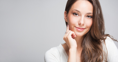 Closeup portrait of a cheerful friendly brunette.の写真素材
