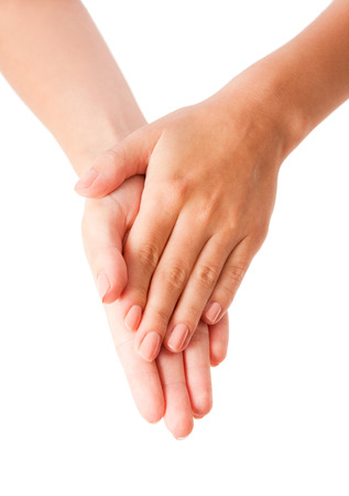 Female hands applying body lotion on white background.の写真素材